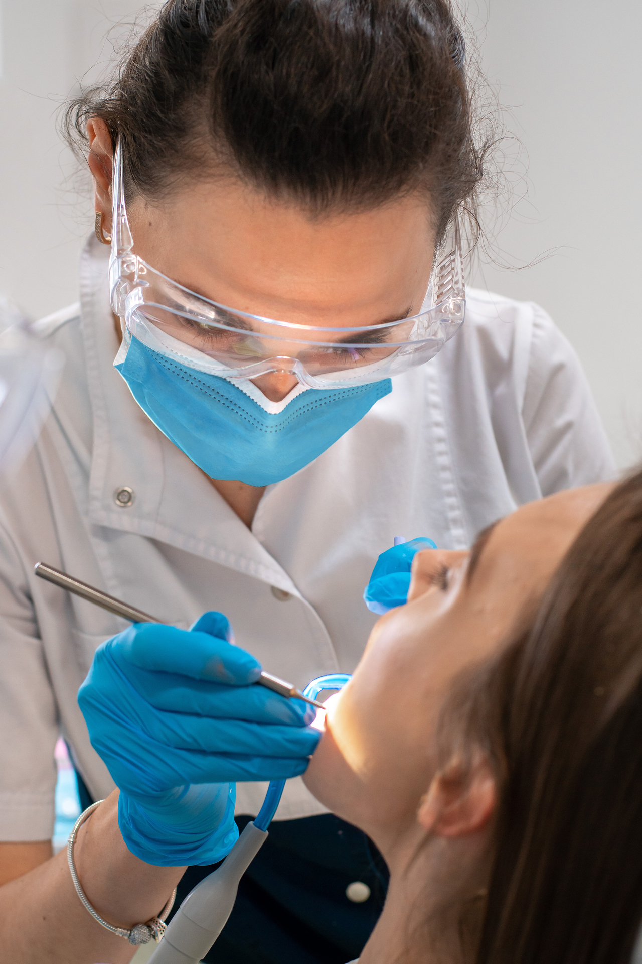 Medical professional providing dental care in New Zealand clinic